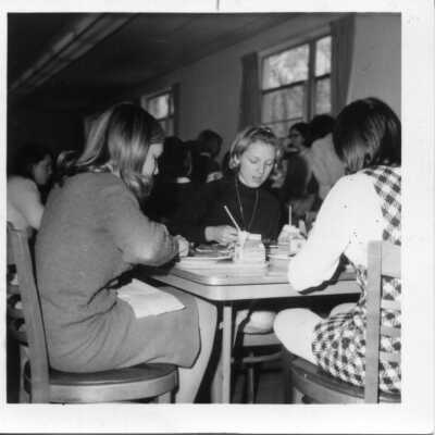 Students eating lunch in cafeteria, 1960s