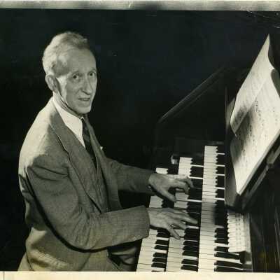 Mr. F. Arthur Henkel playing the organ