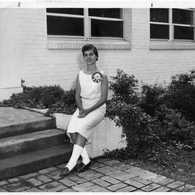 Student wearing Triad button outside the Upper School circa 1960s.