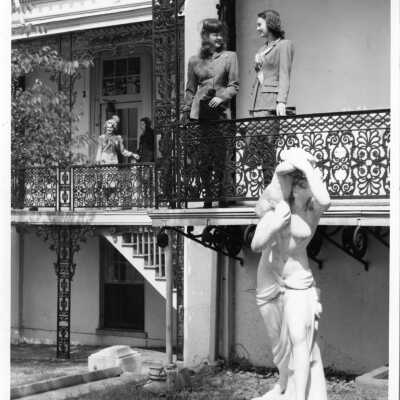 Four women on balconies