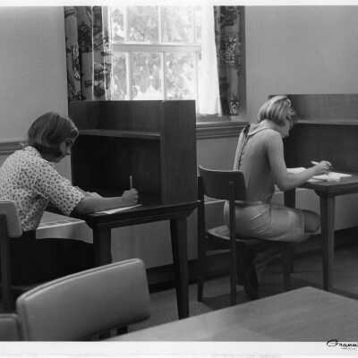 Students studying at desks in the library, 1967
