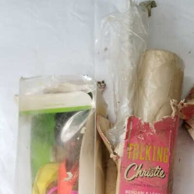 Christie box with added items in paper towel tube and plastic bag.
