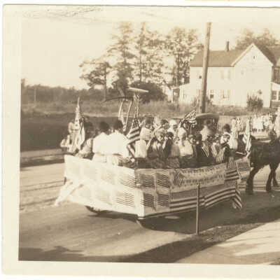 Marchers and Decorated Drays on Parade