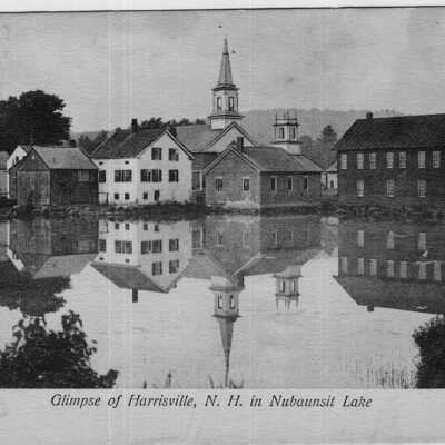 Glimpse of Harrisville Village reflected in Nubaunsit Lake