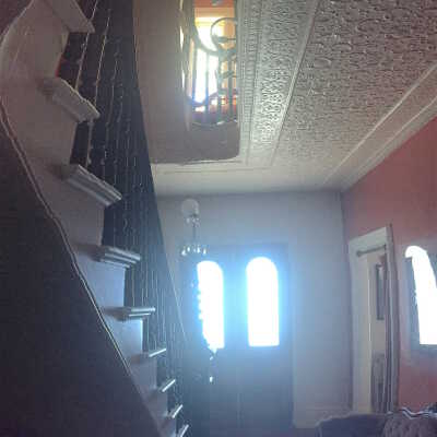 Hayden House | 17 Boynton Street, Eastport, Maine | View Looking Up Front Staircase Towards Front Door