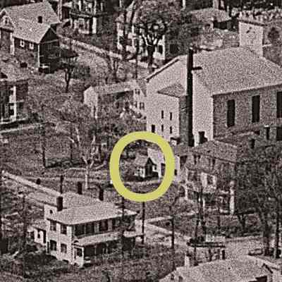 Playhouse (within yellow circle) in its original location next to attached barn of Hayden house on Boynton Street, Eastport, Muselenk (Moose Island), Maine, c.1930.