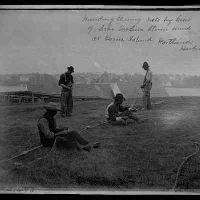 Mending Herring Nets by Crew of Schoooner Aroline Storm bound at House Island, Portland Harbor