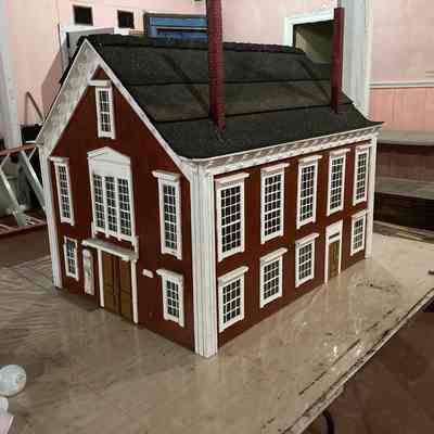 Model of Memorial Hall made by George McLean (husband of Fran McLean) of Eastport, Maine. Made before 1995, in early 1990s. Model was part of presentation held at the Eastport Arts Center on the different opera houses in Eastport over time. Gift of Alberta Hunter of Eastport, Maine, 2023.