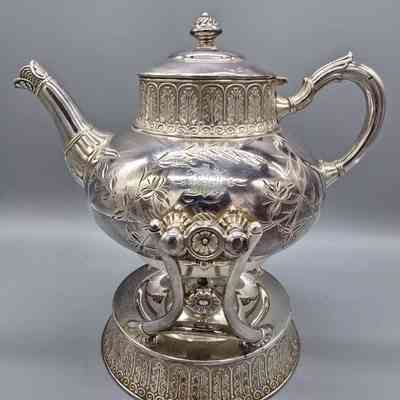 From Ebay Listing, June 26, 2025: Antique James Tufts Quadruple Plate Silver Tea With Cradle 1894. US $525.00