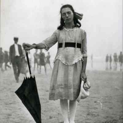 Young woman with an umbrella at Old Orchard Beach