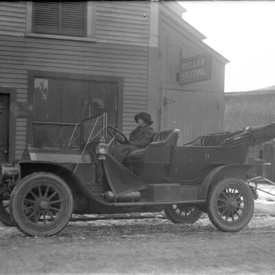 Woman in car in front of Saco Roller Skating