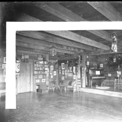 Reverse side with section of postcard pasted on.