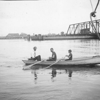 Three men on a rowboat