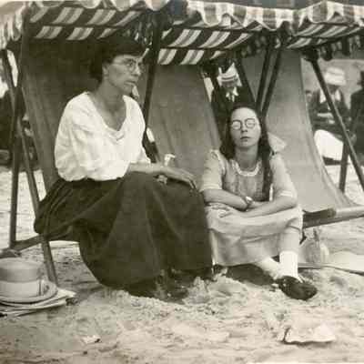 Two women on lounging chairs at Old Orchard Beach