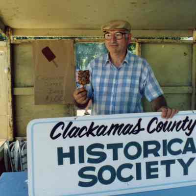 Curran Cox Holding Clackamas County Historical Society Sign.