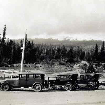 Four various Model A Cars parked (possibly at a Mount Hood roadside)