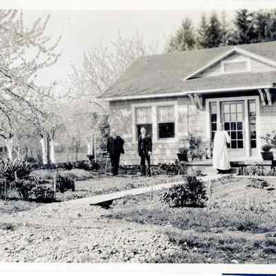 Three (3) Unidentified People in front of a house - Talbert Collection