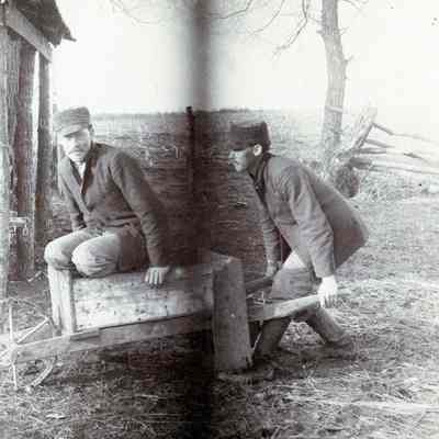 Unknown Men with Wheel Barrow on Farm 1903