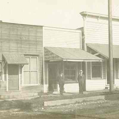 Alldridge Family - Two Men In Front of Confectioner's Shop