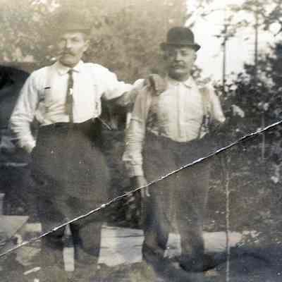 Two Men and Child by House Steps - Hopp Family Collection