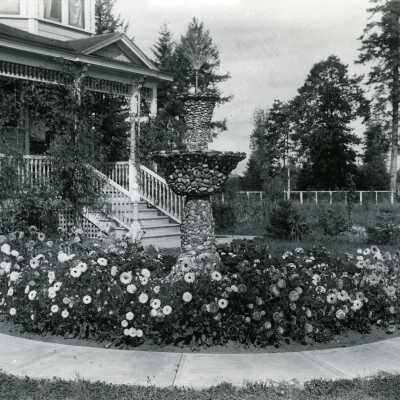 Chambers Howell House - Front of House with Fountain and Flowers