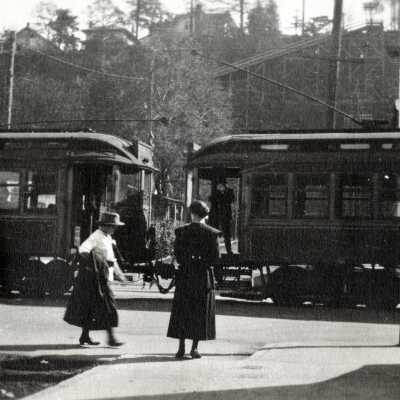 Women standing by Interurban Rail Cars In Oregon City