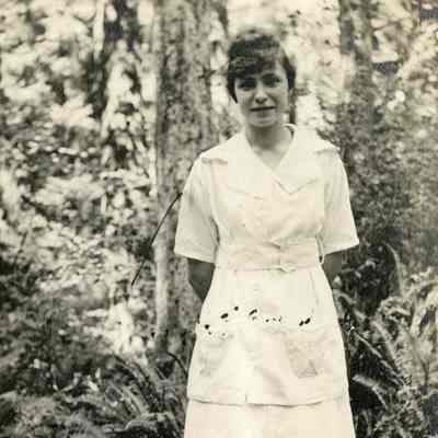 Unknown Young Woman In a Mid-Calf Dress