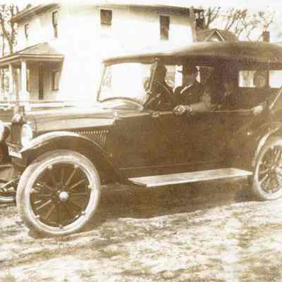 Unidentified Men in a Model A Roadster - Four Square House in Background