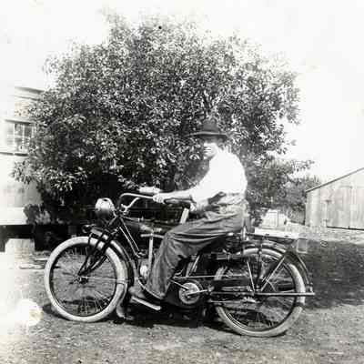 Man on Early Motorcycle