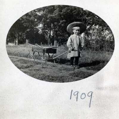 Boy with wagon. 1909