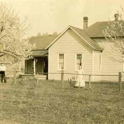 Unidentified House with Man and Woman in Front - Talbert Collection