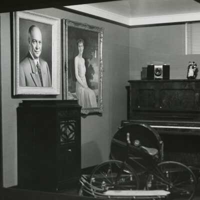 Photograph of Room with two individual paintings of President Dwight and Mami Eisenhower