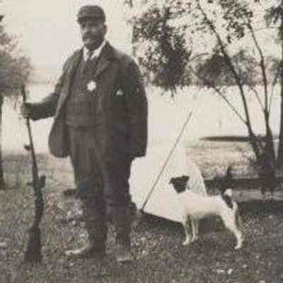 Fred (unknown last name) standing with Gun - Talbert Collection
