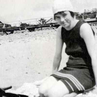 Unknown Woman in Bathing Suit on Sandy Beach