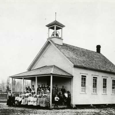 Rural Dell School House with Students