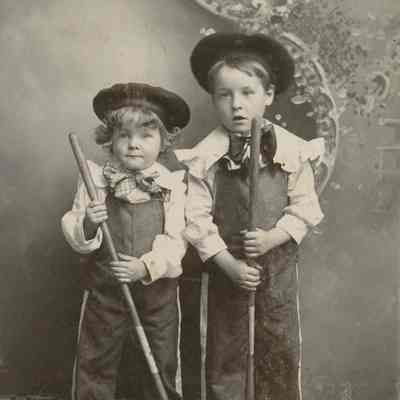Portrait of Two Unknown Young Boys with Garden Hoes