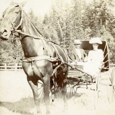 Man and Woman in horse drawn buggy 1897