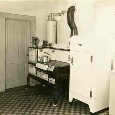 Unknown Kitchen - Wood Stove and Refrigerator