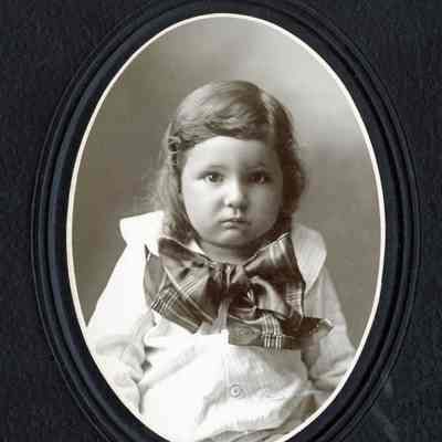 Unknown Baby Girl with a Big Bow and Ringlets