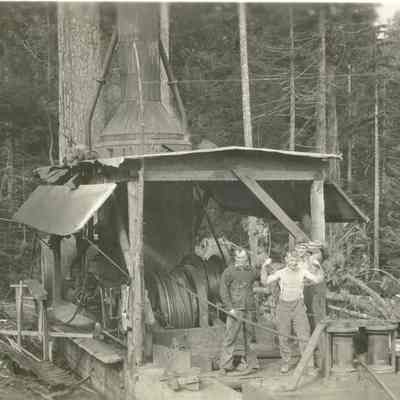 Three Men with Steam Donkey used for Moving Logs