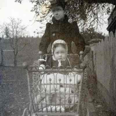 Unknow Woman Pushing a Baby in a Baby Buggy