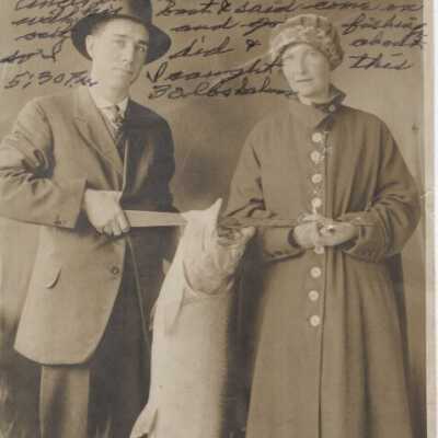 Man and Woman holding a Salmon - 1918