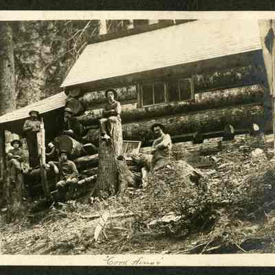 Lumber Crew Sitting at the Logging Camp's "Cook house". Date and Location Unknown.