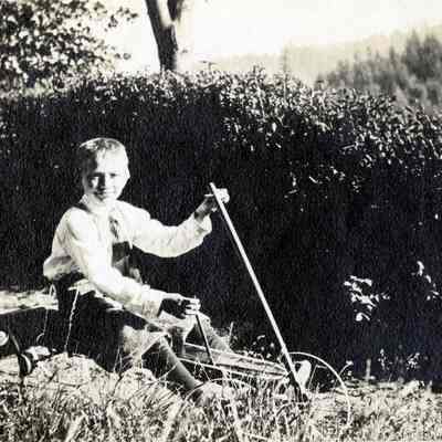 Young Boy in Peddle Cart
