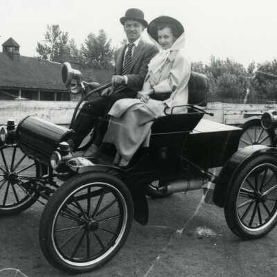 Runabout Automobile with Man and Woman riding in it