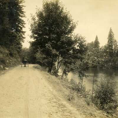 Clackamas River with Horse and Buggy on Tree Lined Road