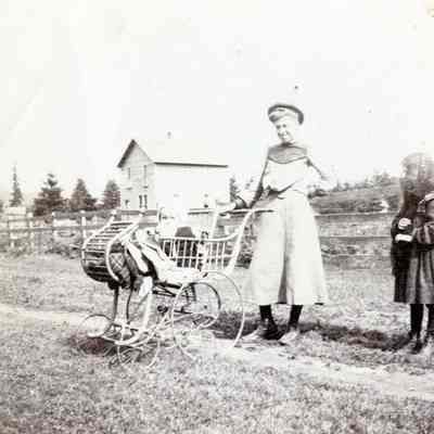 Unknown Woman, Two Children and Baby Buggy