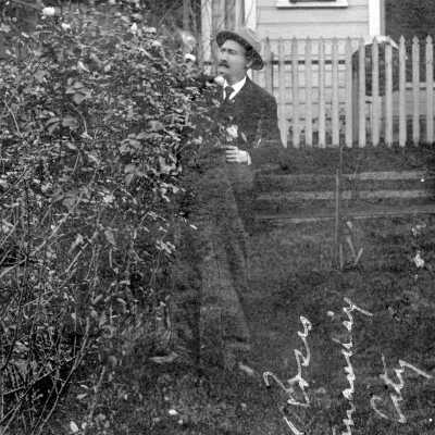 Oregon City 1907 - Al Knapp Picking Roses on Christmas Day