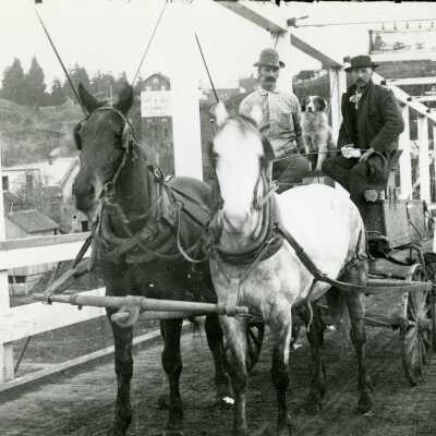 Horses pulling wagon across Old Oregon City bridge