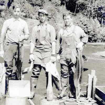 Unknown Fishermen with Catch on Dock